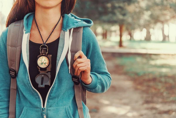 Tourist girl with compass — Stock Photo, Image