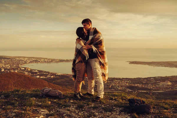 Loving couple standing outdoor at sunset — Stock Photo, Image