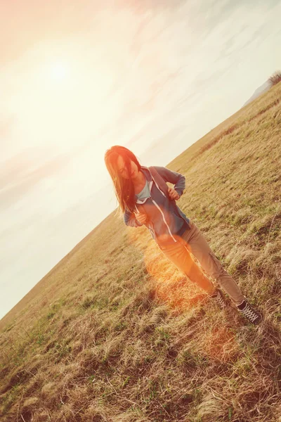 Beautiful girl walking on summer meadow — Stock Photo, Image
