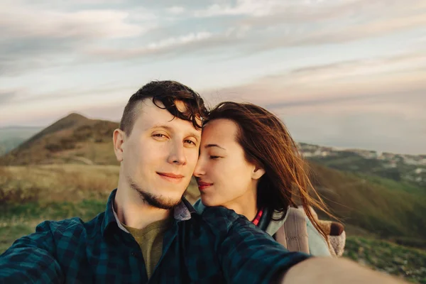 Happy loving couple taking self-portrait outdoor — Stock Photo, Image