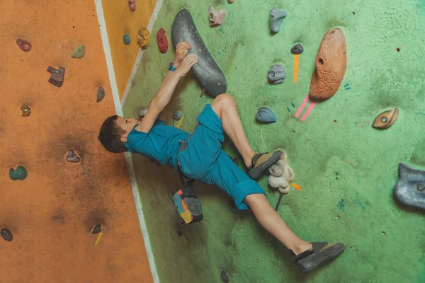 Little boy on practical wall — Stock Photo, Image