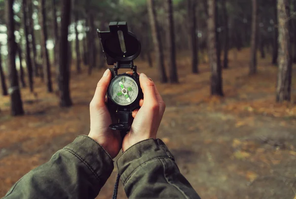 POV of hands with a compass — Stok fotoğraf