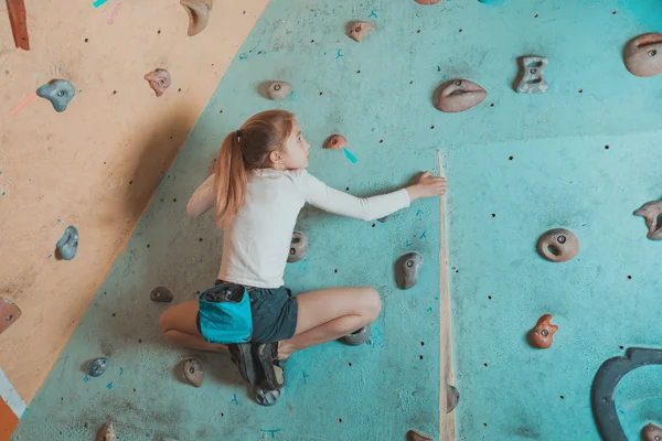 Climber little girl exercises in gym — Stock Photo, Image