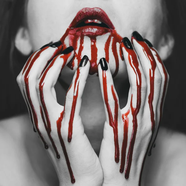 Woman touching her face in blood — Stock Photo, Image