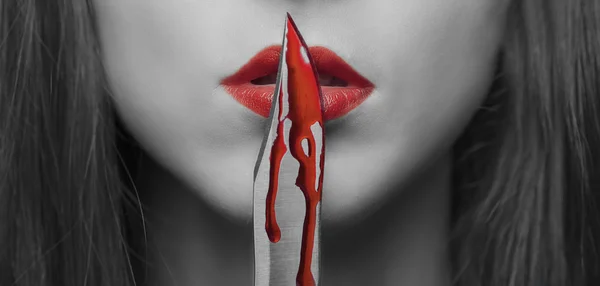 Dangerous woman with knife in blood — Stock Photo, Image