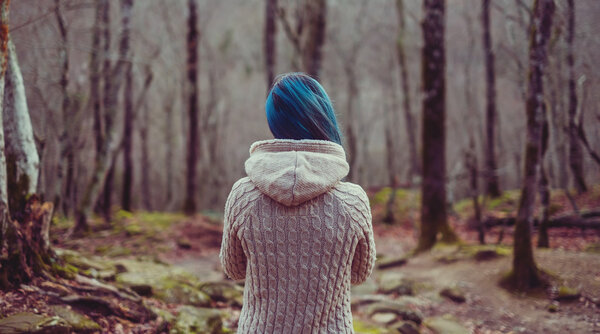 Woman walking in the forest