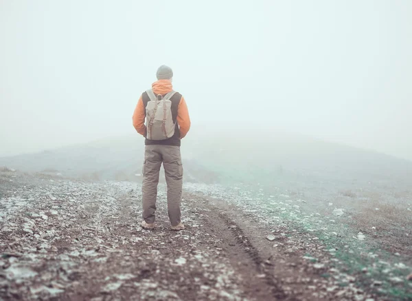 Hiker standing on road — Stock Photo, Image