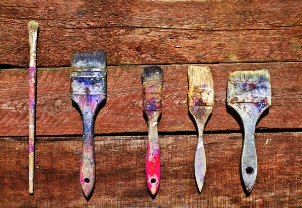 Dirty old dried brushes for painting works — Stock Photo, Image