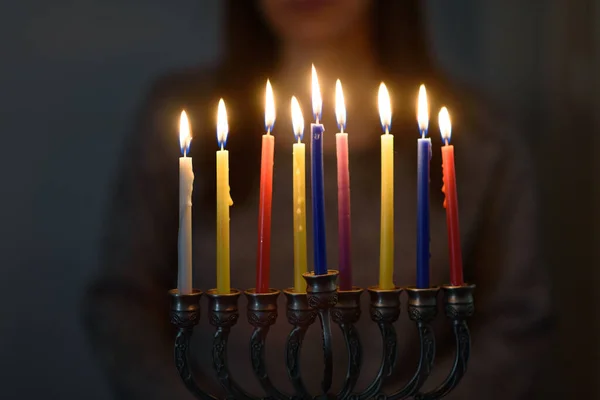 Jewish holiday Hanukkah background with menorah and colorful burning candles. — Stock Photo, Image
