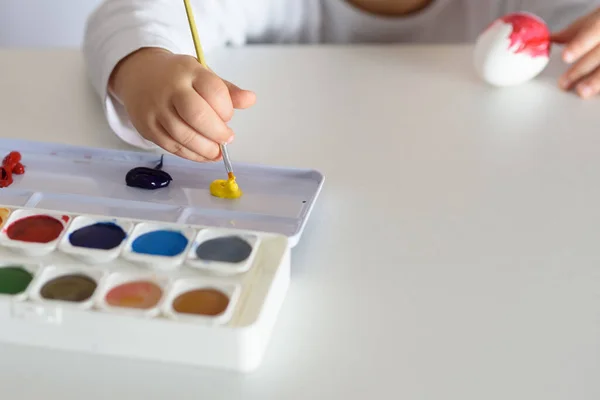 Child Hands Painted Easter Eggs Paints Brushes White Table Preparation — Fotografia de Stock