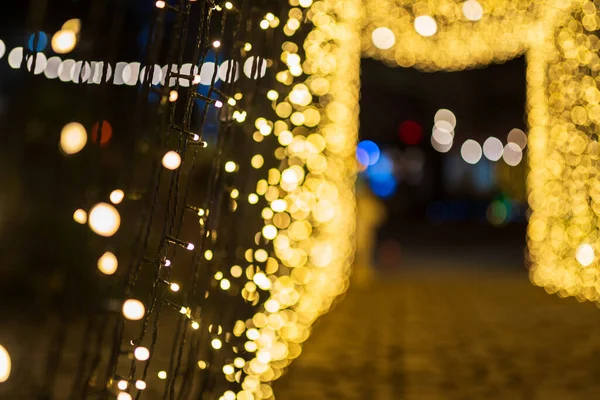 Yellow Colorful light Abstract circular bokeh of The light tunnel Christmas tree background Decoration During Christmas and New Year Festival illumination.