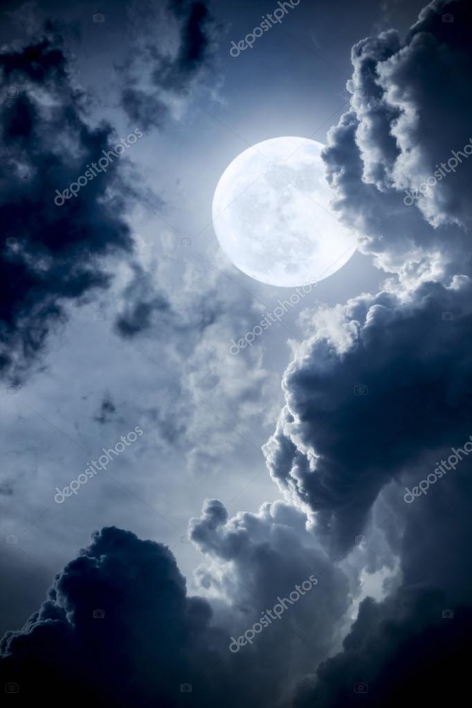 This Dramatic Photo Illustration Of A Nighttime Scene With Brightly Lit Clouds And Large Full Blue Moon Would Make A Great Background For Many Uses Stock Photo Image By C Rcreitmeyer