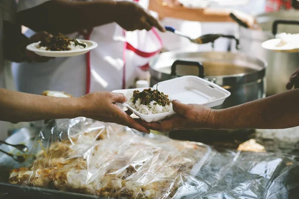 Volunteers Share Food to the Poor: The Concept of Donating Food to the Poor