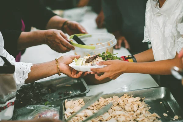 Sharing of food from volunteer hands to homeless people : The concept of sharing