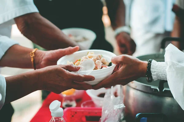 Sharing Food to Homeless and the Poor: The Concept of Feeding
