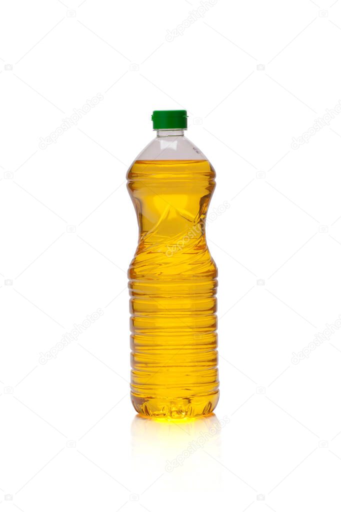 Golden yellow oil in a bottle on a white background
