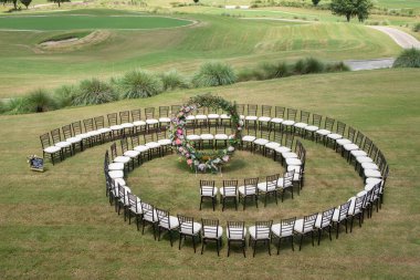 Unique round spiral chair pattern wedding ceremony close up  clipart