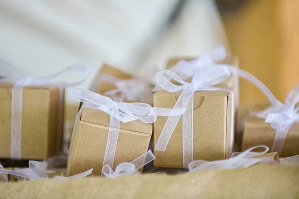 Miniature Brown Cardboard Gift Boxes Wrapped White Bows Laces Canvass — Zdjęcie stockowe