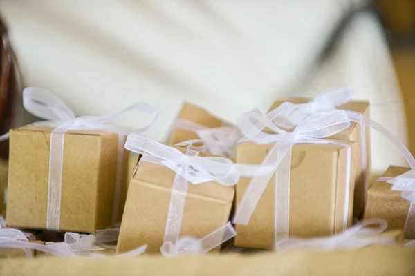 Miniature Brown Cardboard Gift Boxes Wrapped White Bows Laces Canvass — Zdjęcie stockowe