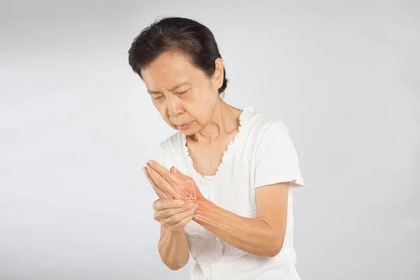 old asian woman feel wrist bones injury