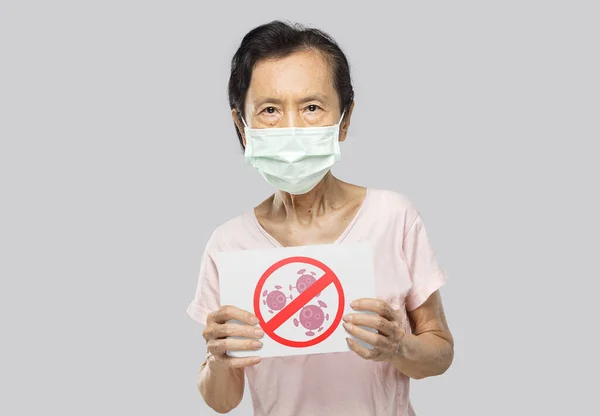 Asian Old Woman Wearing Mask Holding Virus Banner — Stock Photo, Image