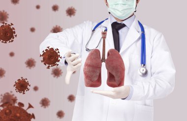 doctor held the lungs and made hand to prevent virus floating in the air clipart