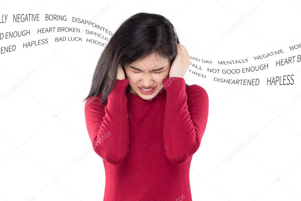 young asian woman covering her ears with her hands , feeling stressed by various problems , concept mental health