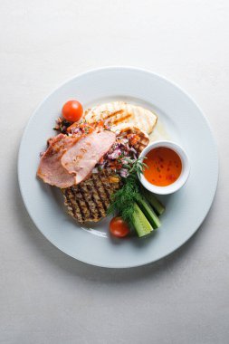 Menu for the restaurant: a plate with brisket, pork, chicken, ve