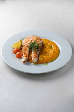 Menu for the restaurant: Trout steak served with carrot and pota