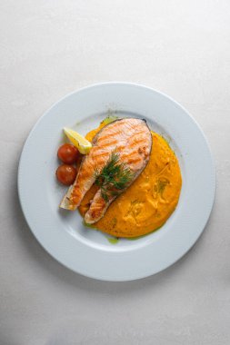 Menu for the restaurant: Trout steak served with carrot and pota