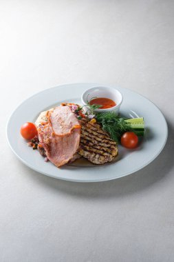 Menu for the restaurant: a plate with brisket, pork, chicken, ve