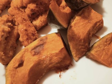  Crispy Fried Strips and Roasted Japanese Pumpkin (Kabocha) on White Plate