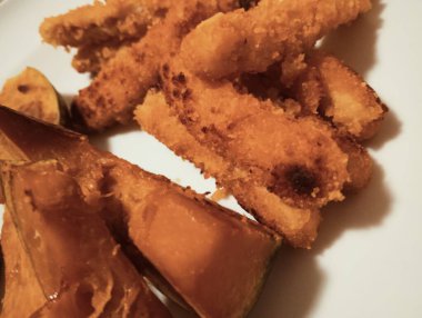  Crispy Fried Strips and Roasted Japanese Pumpkin (Kabocha) on White Plate
