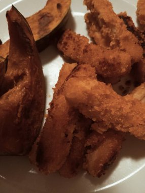  Crispy Fried Strips and Roasted Japanese Pumpkin (Kabocha) on White Plate