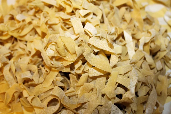 Italian homemade pasta, uncooked noodles — Stock Photo, Image