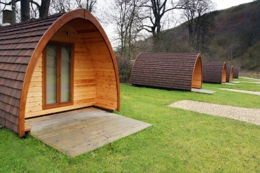 Camping pods in an empty rural camp site in the UK clipart