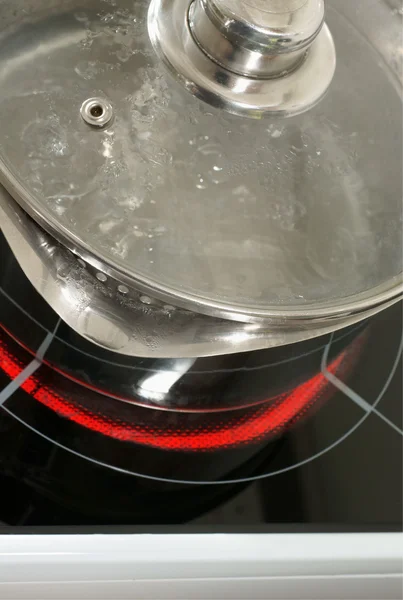 Saucepan on a halogen hob — Stock Photo, Image