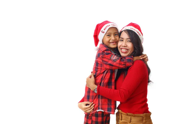 Щаслива Азіатська Молода Мати Колінах Обіймаючи Сина Різдвяним Костюмом Ізольовані — стокове фото