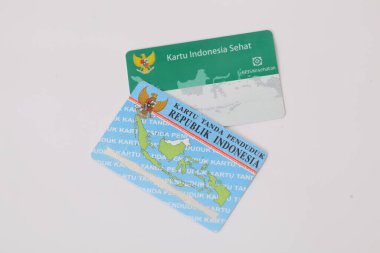 Yogyakarta, Indonesia - Mar 10, 2021 : Kartu Indonesia Sehat(KIS) or Indonesia Health Card and Kartu Tanda Penduduk (KTP) or Indonesian Identity Card