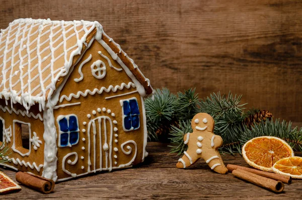 Gingerbread house and man on a wooden rustic