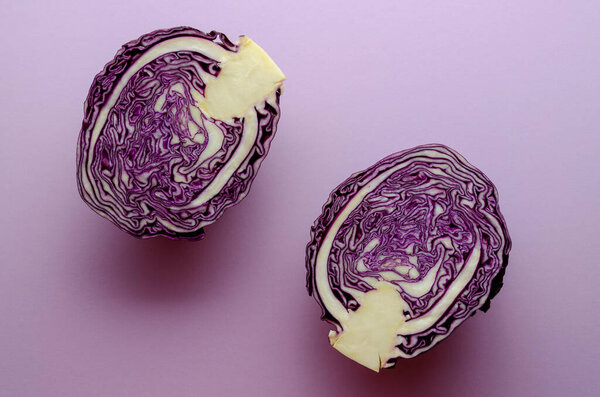 Violet cabbage on violet background. Minimalism.