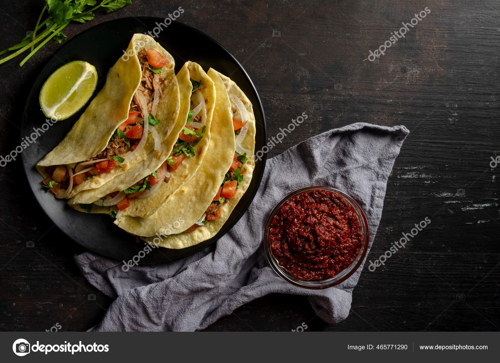 Mexican birria tacos, quesabirria with lime and chili sauce Stock Photo