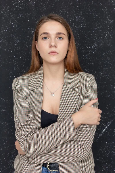 Young attractive caucasian woman with long hair in black top and suit jacket — Stock Photo, Image