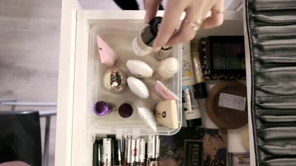 RUSSIA, VLADIMIR, 26 JAN 2021: top view on girl hands taking bottles from drawer — Stock Video