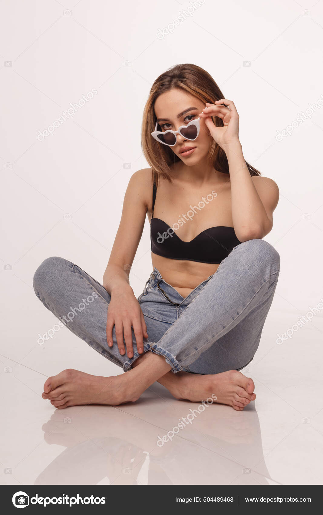 Sexy asian girl posing in lingerie, jeans, sunglasses on white studio  background Stock Photo by ©artem-zacepilin@yandex.ru 504489468