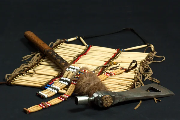 Tomahawk and Indian necklace — Stock Photo, Image