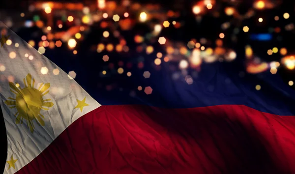 Filippine Bandiera Nazionale Luce Notte Bokeh Sfondo astratto — Foto Stock