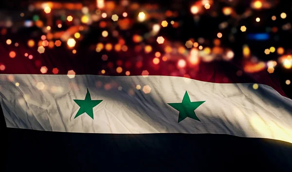 Nationale vlag van Syrië licht nacht bokeh abstracte achtergrond — Stockfoto