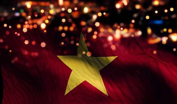 Vietnam Nationalflagge Licht Nacht Bokeh abstrakten Hintergrund — Stockfoto