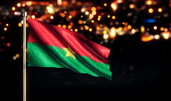 Burkina Fasos flagga Medborgarestaden ljus natt Bokeh bakgrund 3d — Stockfoto